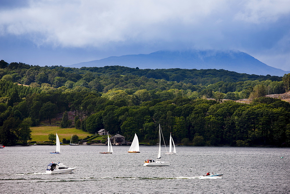 Sailing yachts, motor launch and speedboat on Lake Winderemere viewed from Troutbeck towards Hawkshead in the Lake District National Park, Cumbria, UK