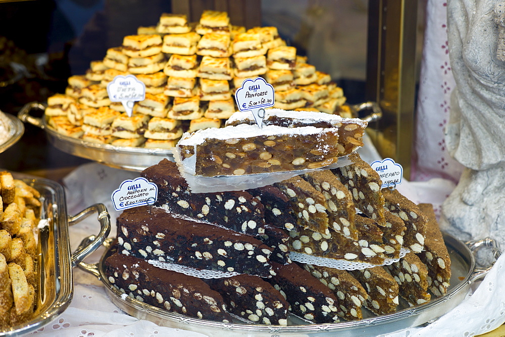 Panforte cakes and pastries in shop window of luxury patticeria, caffe Gilli, established in 1733 in Florence, Tuscany, Italy