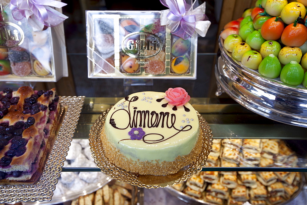 Cakes, sweets and pastries in shop window of luxury patticeria, caffe sweet shop Gilli, established in 1733 in Florence, Tuscany, Italy