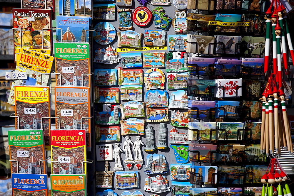 Guidebooks, maps and souvenirs on sale at stall in Piazza di San Giovanni, Tuscany, Italy