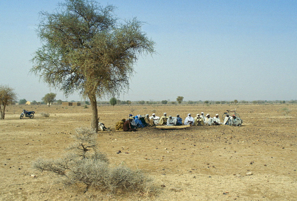 Villagers gather for a funeral in the desert in Burkina Faso (formerly Upper Volta)