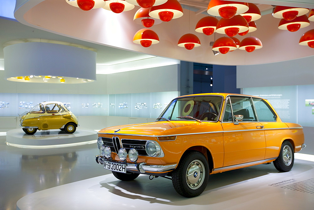 BMW 2002 TI car and Bubble Car Isetta 1955 on display at the BMW Museum and Headquarters in Munich, Bavaria, Germany