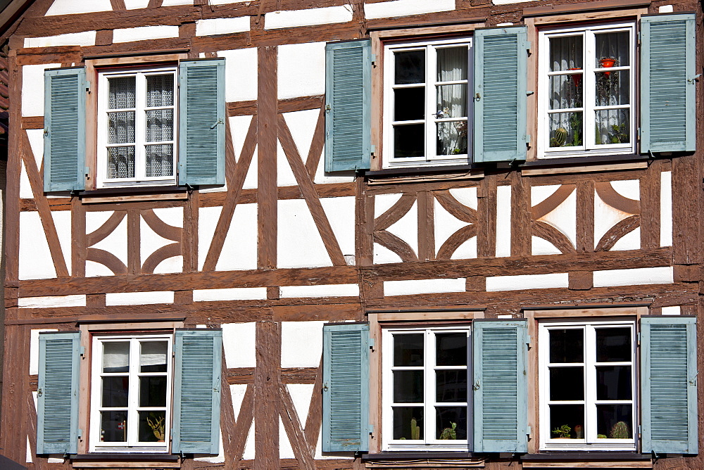 Windows and wooden shutters of quaint timber-framed house in Schiltach in the Bavarian Alps, Germany