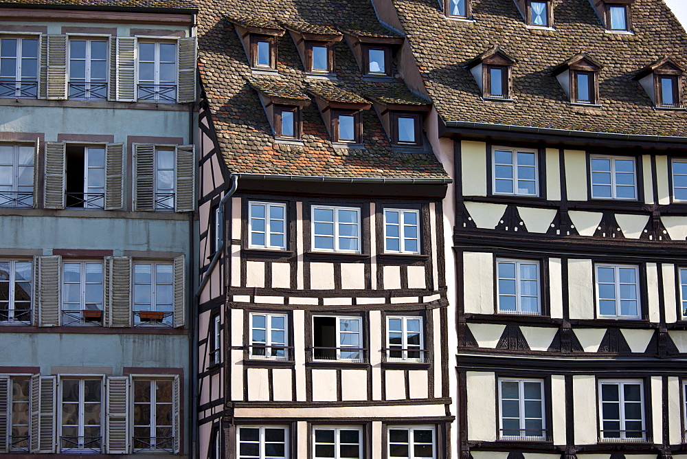 Traditional medieval architecture of canalside buildings along the Navigation Channel in the old part of Strasbourg, Alsace, France