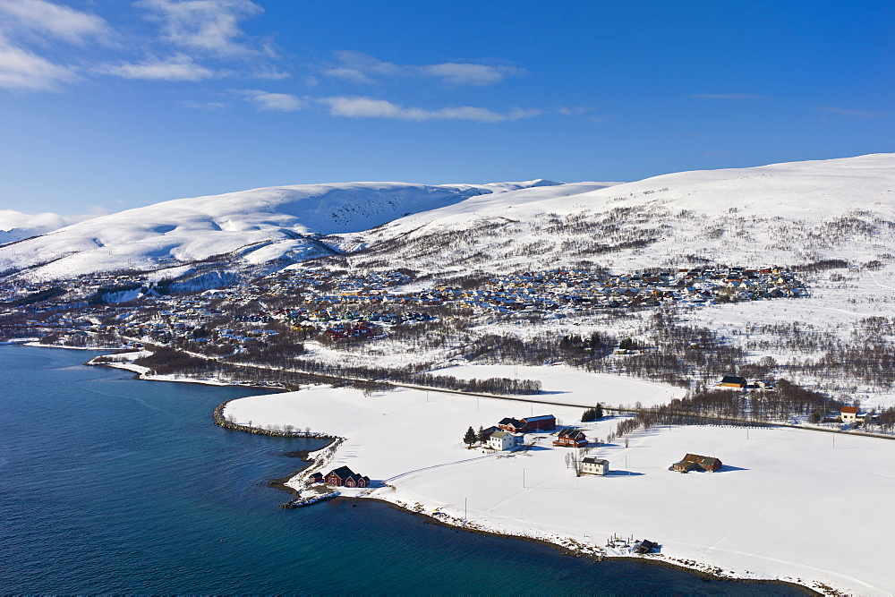 Aerial view of arctic landscape, Kvaloya Island (Whale Island) and Slettaelva Village from aircraft approaching Tromso in the Arctic Circle in Northern Norway