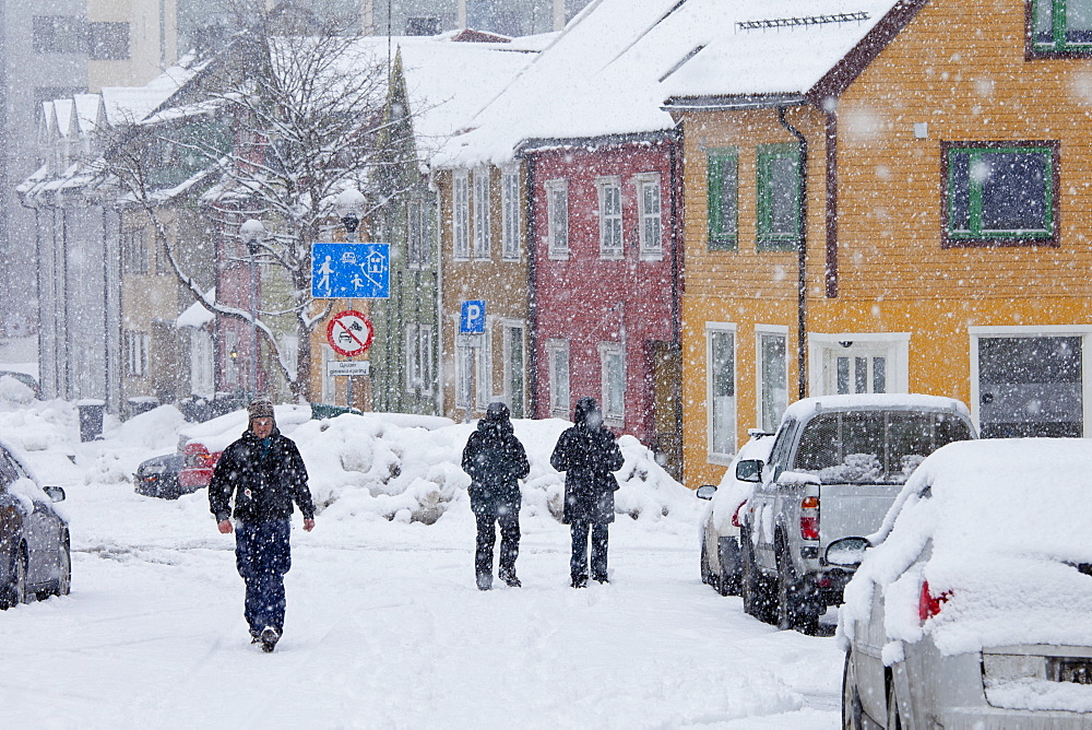 Locals walking in the snow in Tromso within the Arctic Circle in Northern Norway