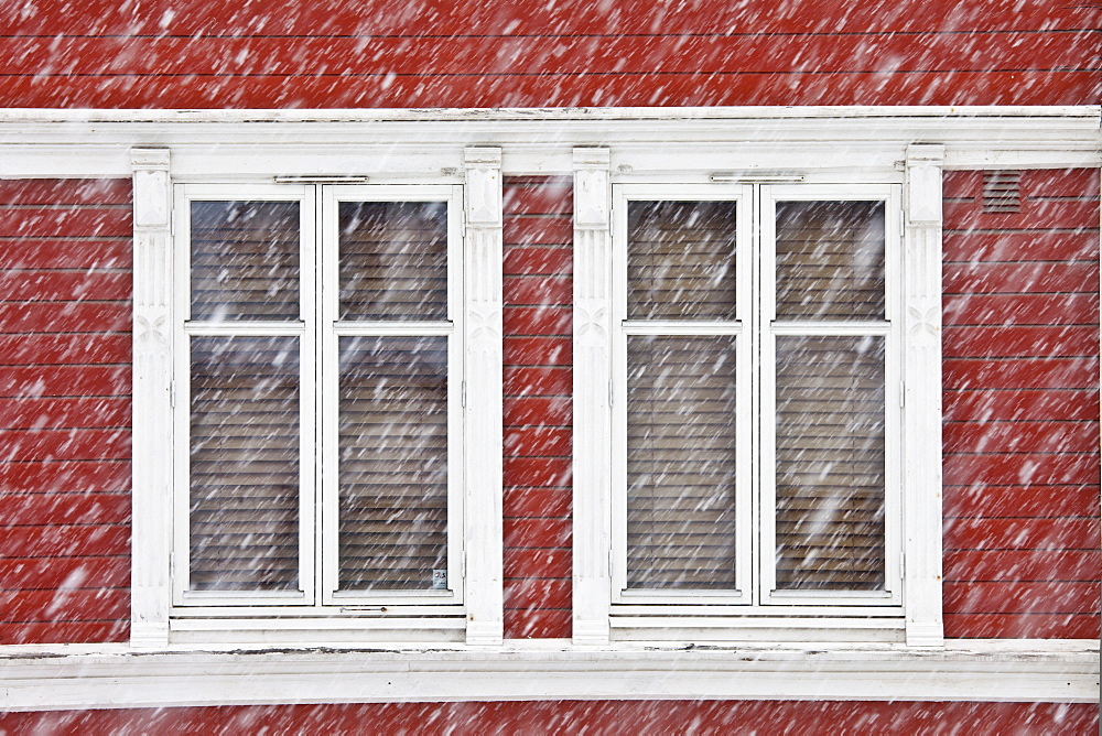 Traditional architecture on snowy day in city of Tromso, in the Arctic Circle in Northern Norway