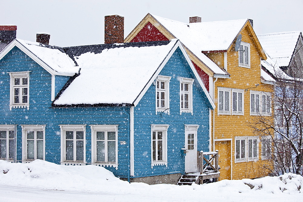 Traditional architecture wooden buildings along Storgata in the quaint area of the city of Tromso, in the Arctic Circle in Northern Norway