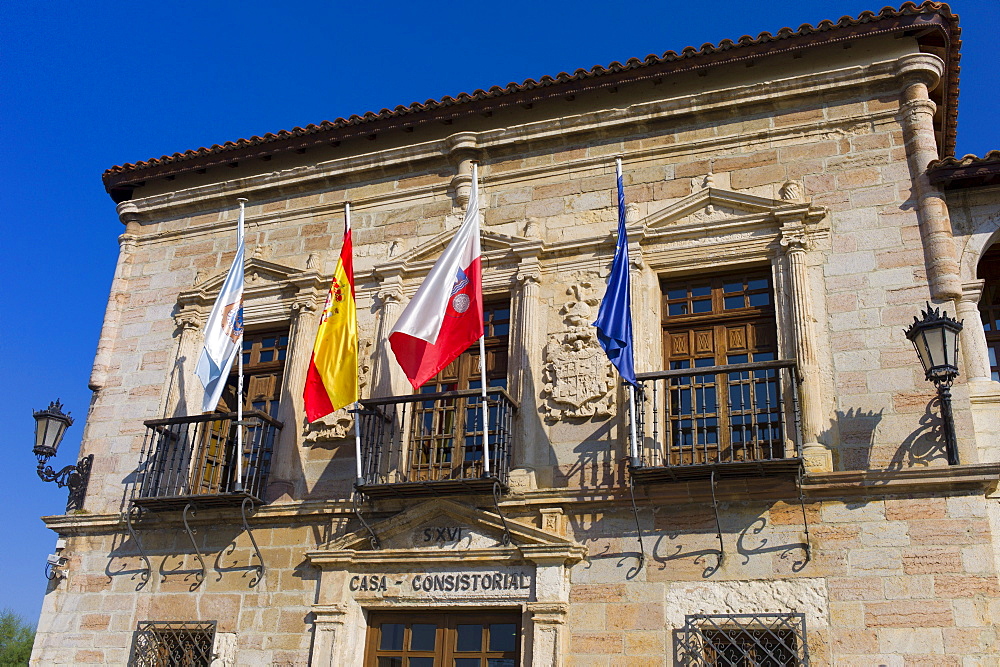 Ayuntamiento, County Hall, 16th Century with flags of Cantabria, Spain and EU in San Vicente de la Barquera, Northern Spain