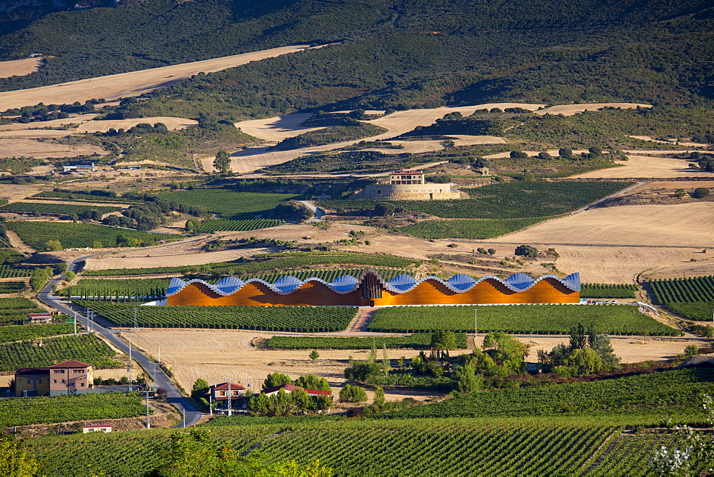 Futuristic architecture in traditional landscape Ysios Bodega winery at Laguardia in Rioja-Alaveda wine-producing area, Spain