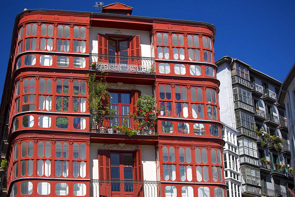 Traditional glasshouses with glass-covered balconies in Bilbao, Spain