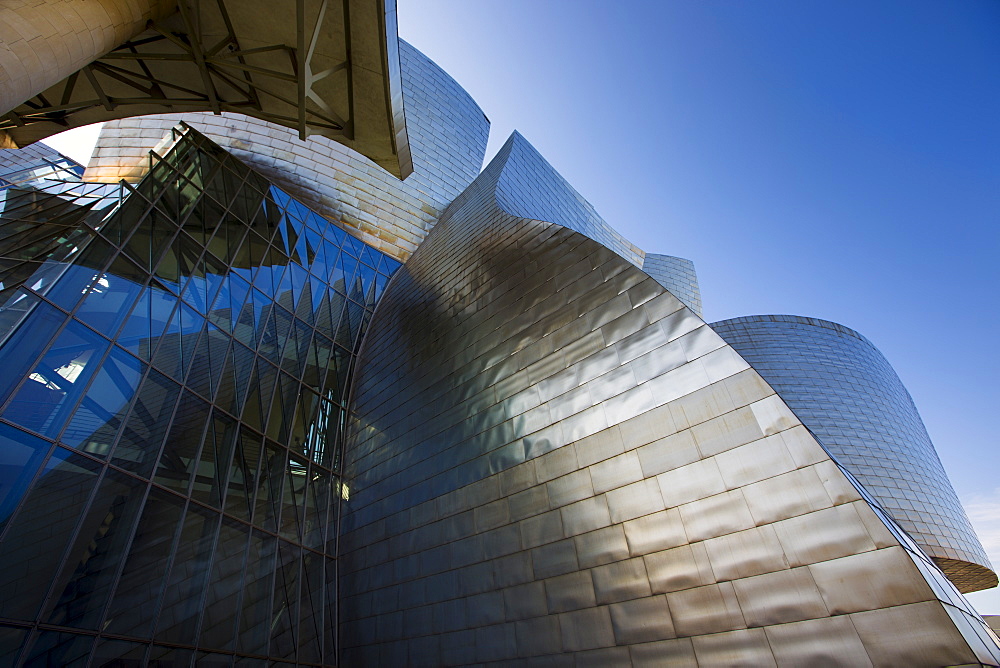 Architect Frank Gehry's Guggenheim Museum futuristic architectural design in titanium and glass at Bilbao, Basque country, Spain