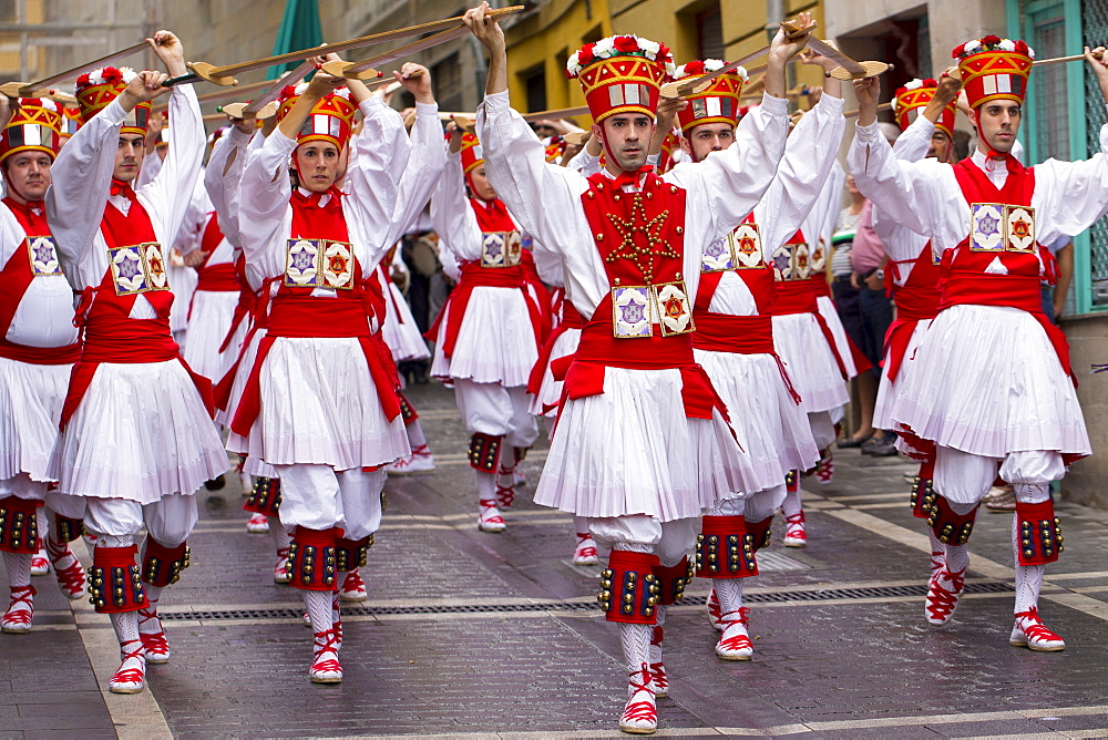 Dancers in procession through the streets during San Fermin Fiesta at Pamplona, Navarre, Northern Spain