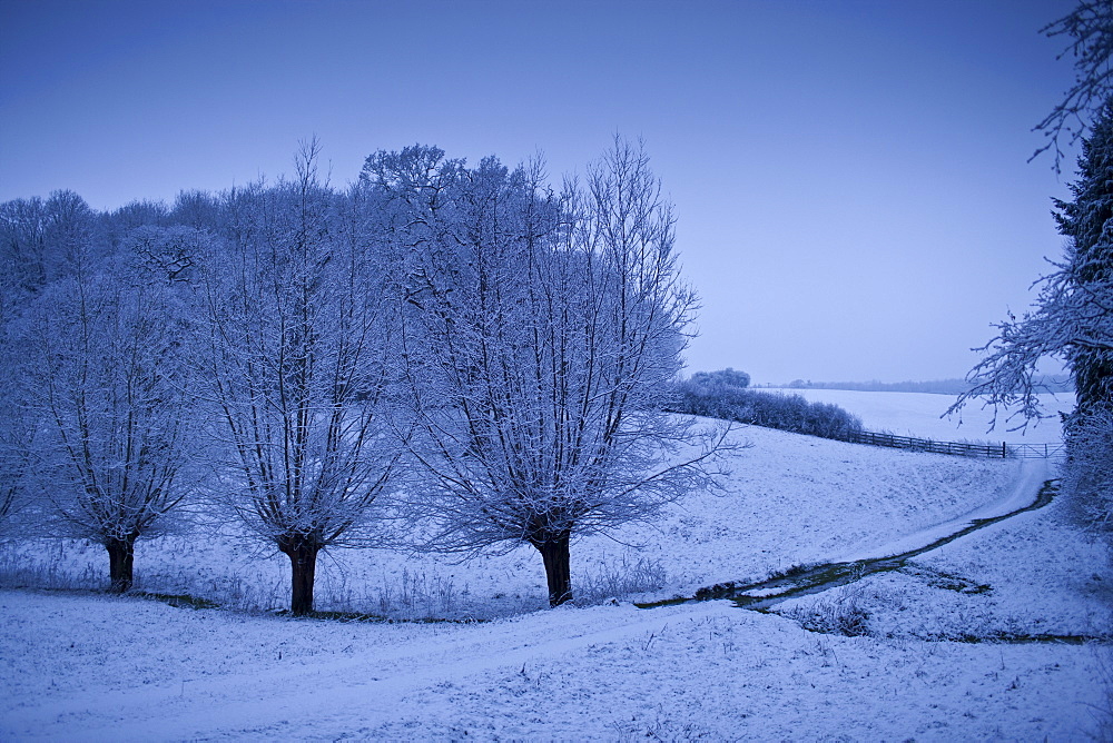 Traditional snow scene in The Cotswolds, Swinbrook, Oxfordshire, United Kingdom