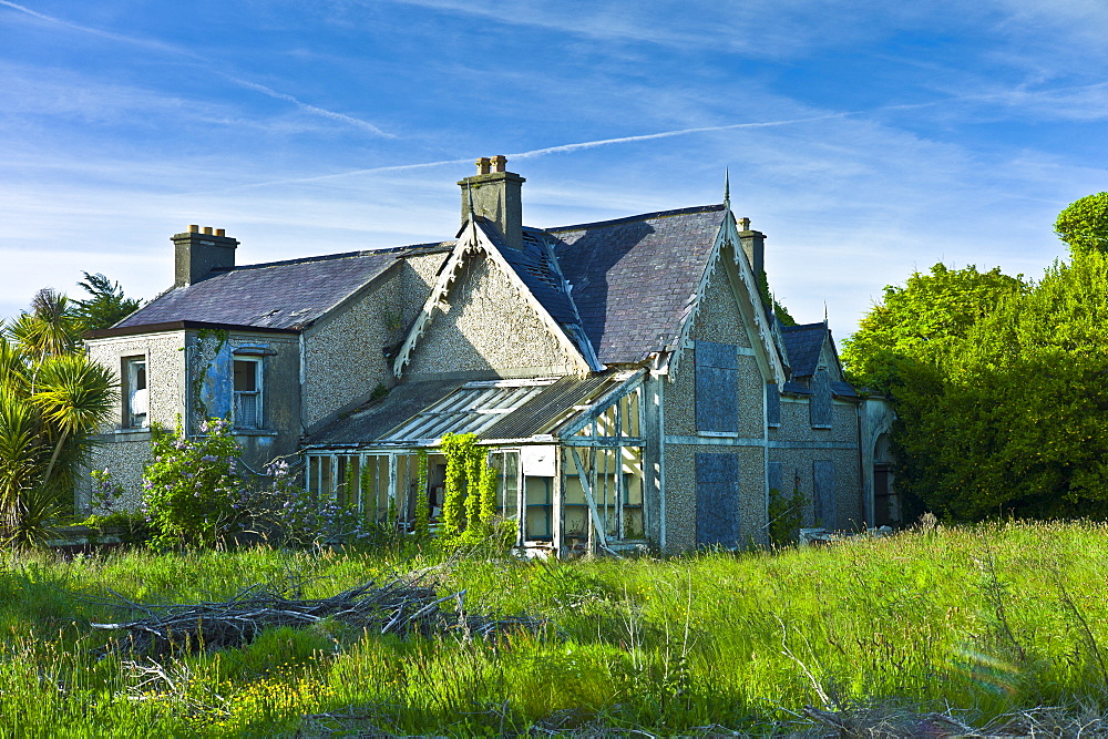 Abandoned derelict detached house awaiting renovation on Ocean Drive, Rosslare, Ireland