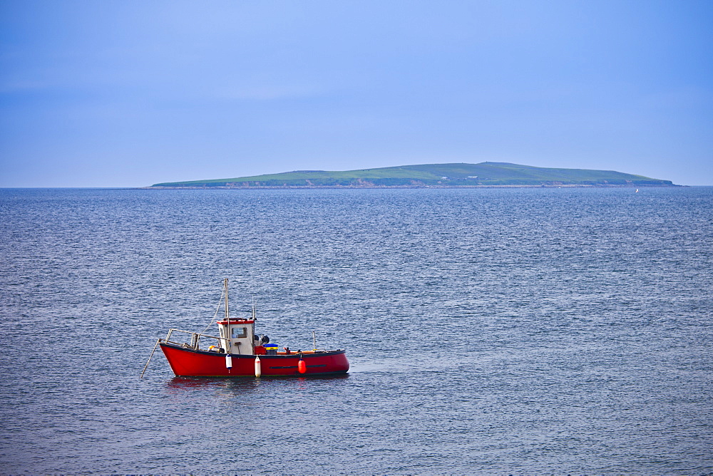 Fishing boat with Saltee Islands in background, Irish Sea at Kilmore, County Wexford, Ireland