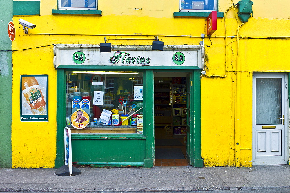 General store in Irish green and gold colour in popular tourist town of Youghal, County Cork, Ireland