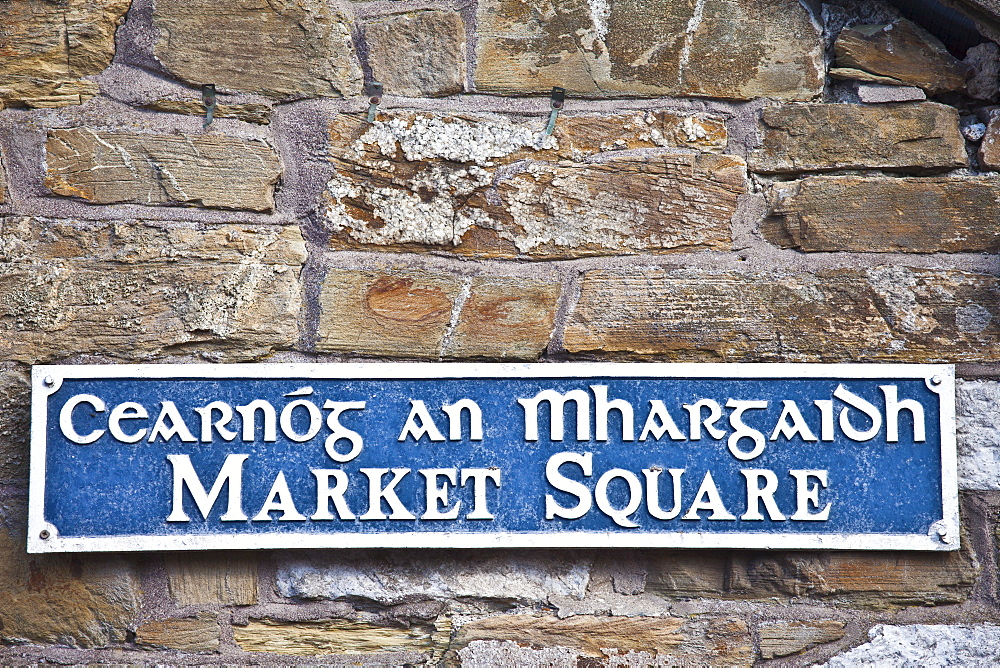 Market Square sign in Gaelic and English in quaint traditional town of Youghal, County Cork, Ireland