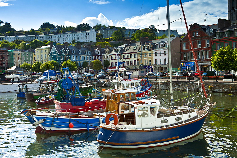 Popular as a tourist destination Cobh harbour with brightly coloured fishing boats in County Cork, Ireland