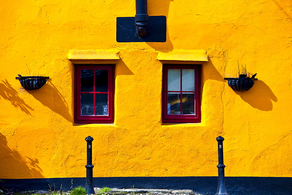 Brightly coloured exterior in terracotta colours of orange and red, Kinsale, County Cork, Ireland