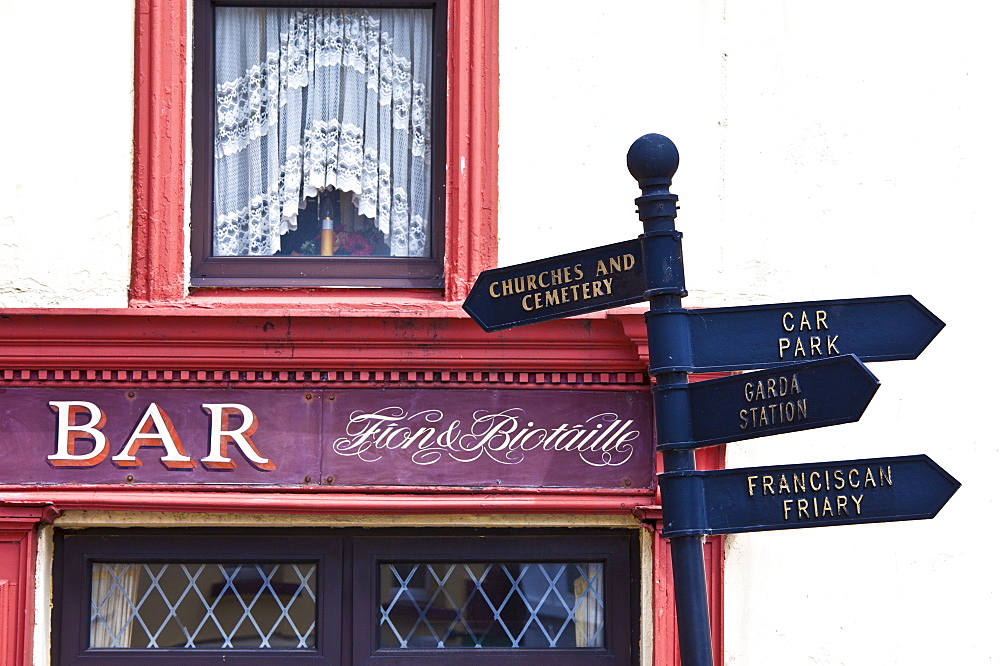 Signpost to Garda, Franciscan Friary, Car Park, Churches and Cemetery in Timoleague, West Cork, Ireland