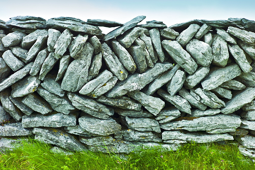 Traditional dry stone wall in meadow in The Burren, County Clare, West of Ireland