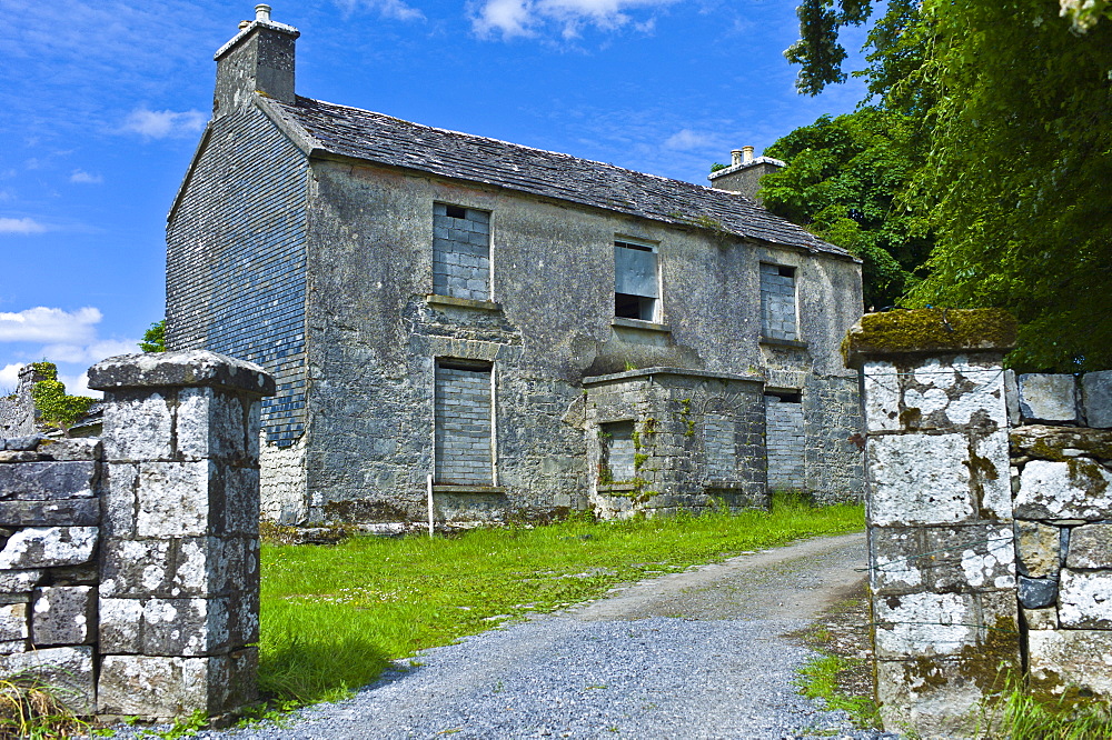 Derelict two-storey old rectory house in rural setting, Kilfenora, County Clare, West of Ireland