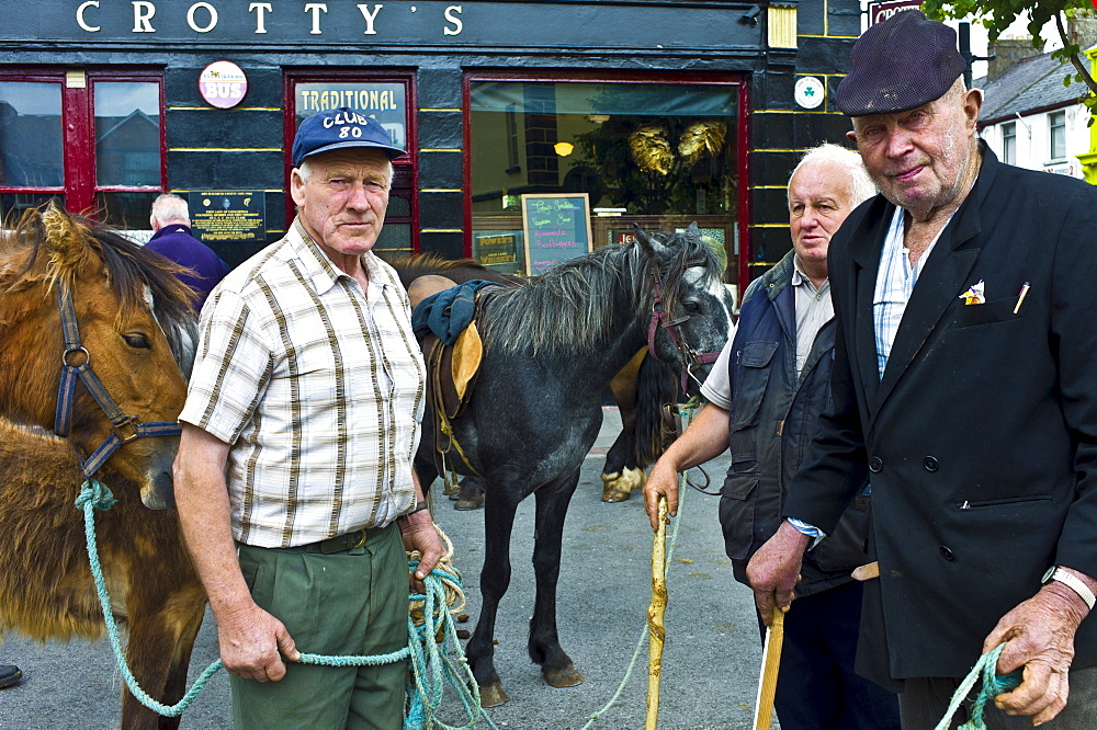 Horse fair in market square in Kilrush, Co. Clare, Ireland. Traditional for locals and travellers to trade horses and ponies