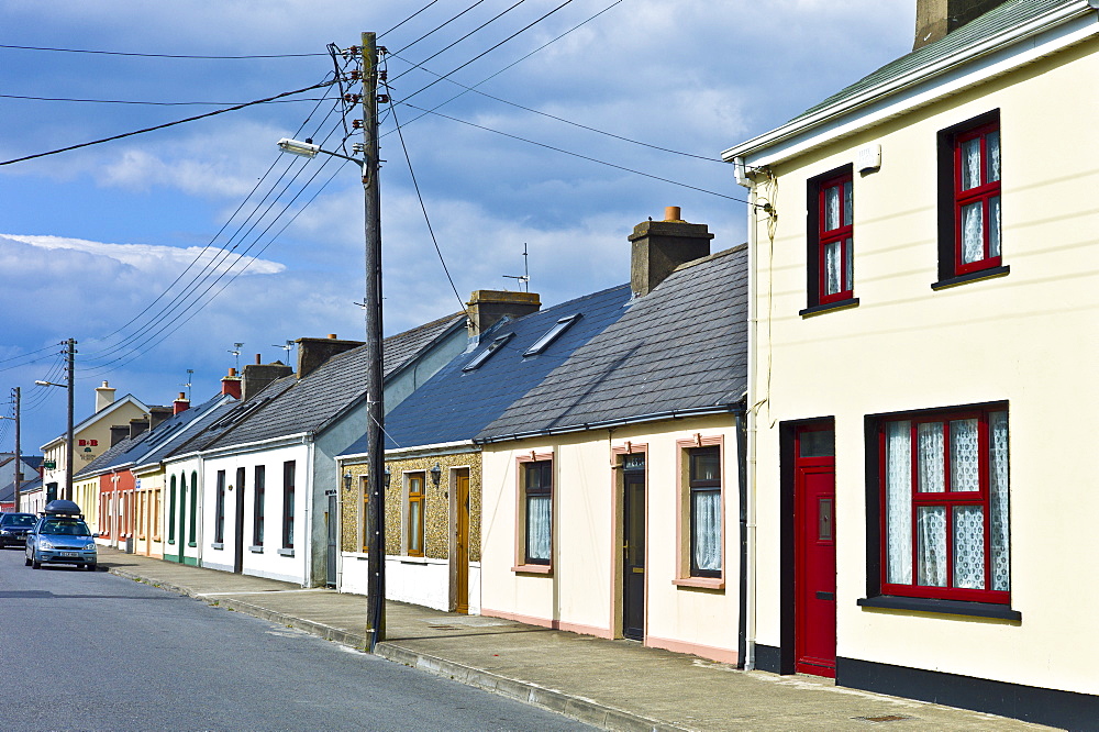 Street scene pastel painted terraced homes in Kilkee, County Clare, West of Ireland