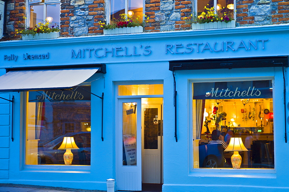 Mitchell's seafood restaurant lit by lamplight, Clifden, Connemara, County Galway, Ireland