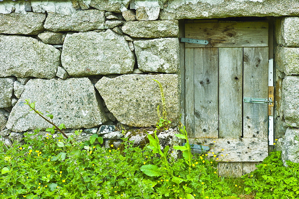 Old stone traditional cottage with block stones at Rosmuch, Connemara, County Galway, Ireland