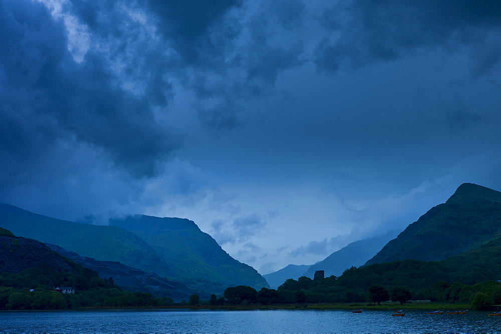 Llanberis Pass with Snowdonia on right, Dolbadarn Castle and Llyn Padarn lake, in Snowdonia National Park, Wales