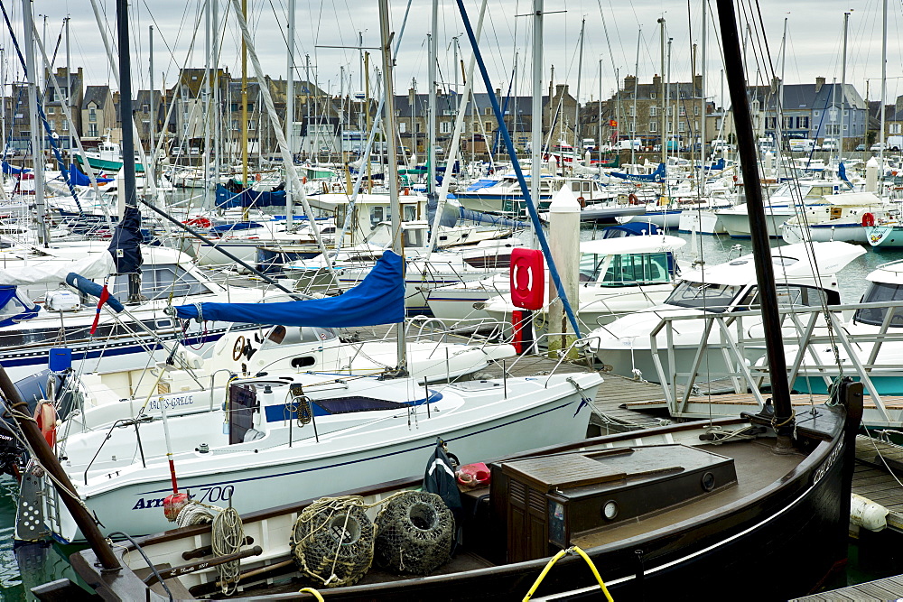 Yachts and power boats moored in the Marina at St Vaast la Hougue channel port in Normandy, France