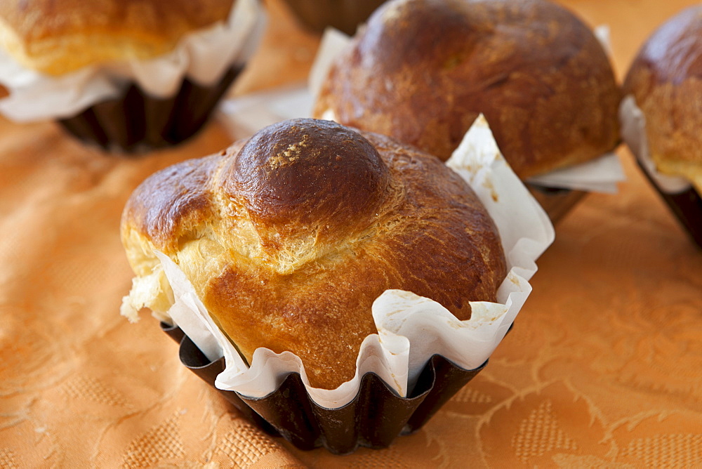 Freshly-baked French brioche on sale at food market at La Reole in Bordeaux region of France