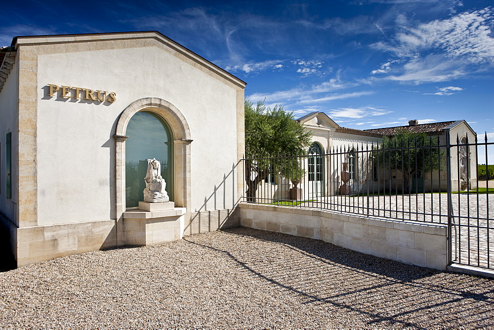 The famous Chateau Petrus wine estate, with statue of St Pierre, at Pomerol in the Bordeaux region of France