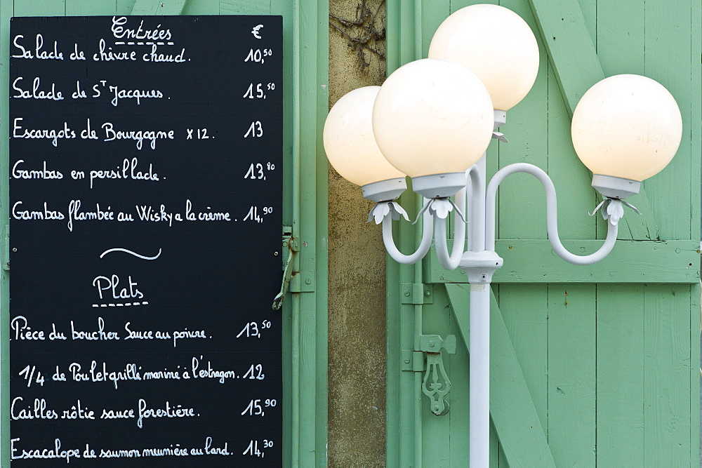 Traditional French Cafe menu of Entrees and Plats in quaint town of Castelmoron d'Albret in Bordeaux region, Gironde, France