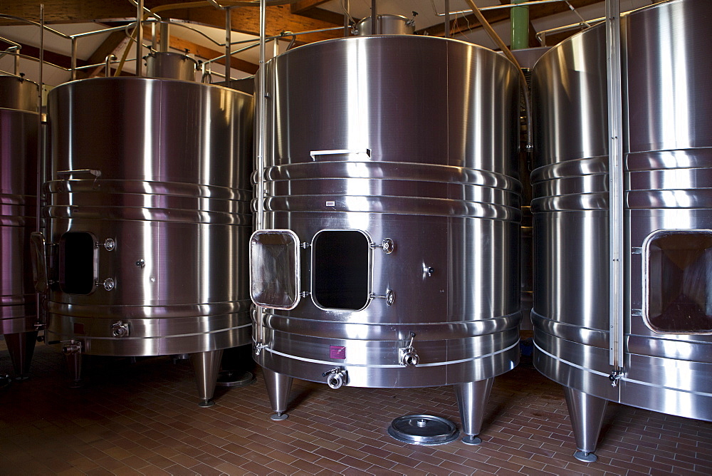 Stainless steel wine vats at Chateau Beau-Sejour Becot at St Emilion in the Bordeaux wine region of France