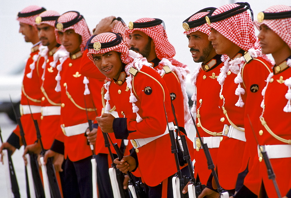 Armed soldiers parade in ceremonial uniform in Abu Dhabi