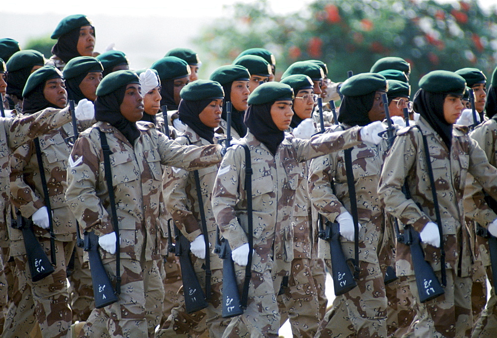 Female armed soldiers parade in camouflage uniform in Abu Dhabi for celebration of 20th Anniversary of United Arab Emirates