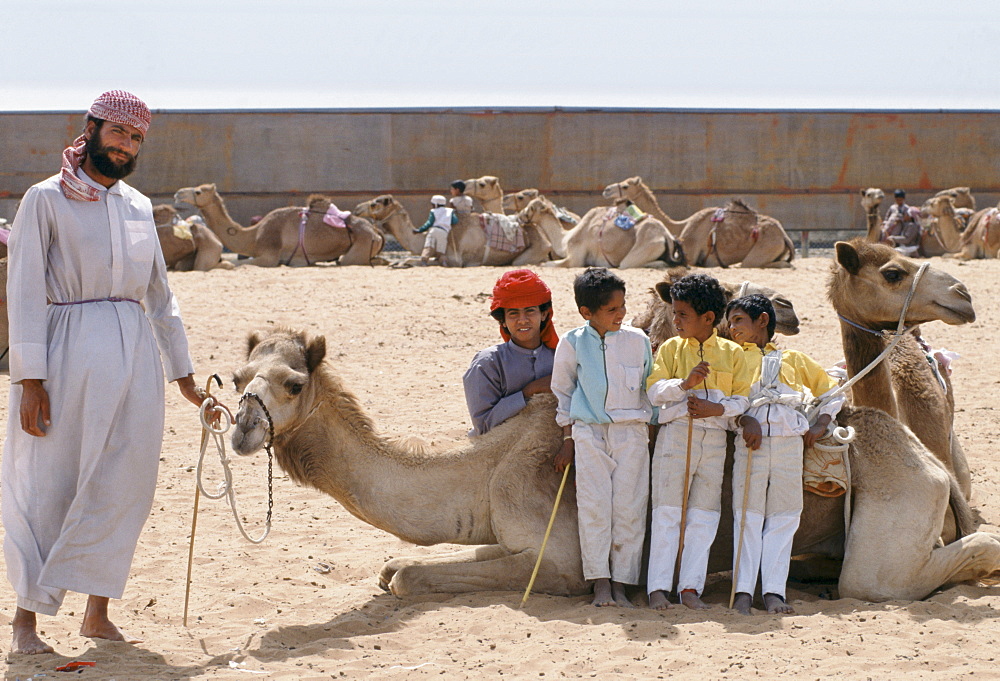 Camel racing with boy jockeys at Al Ain in Abu Dhabi, United Arab Emirates, Middle East