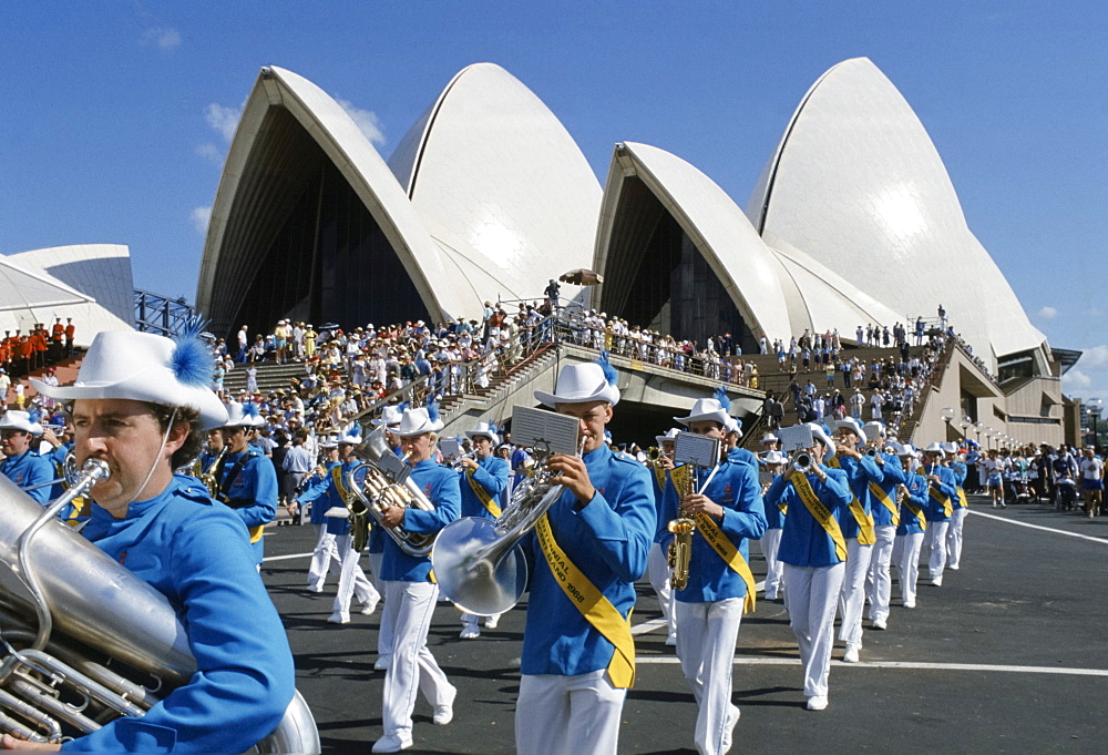 Carnival parade and musical band for celebrations at Sydney Opera House by Sydney Harbour Bridge for Australia's Bicentenary,1988