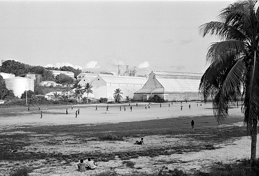 Locals playing football at phosphate (fertiliser) works on the island of Nauru in the South Pacific