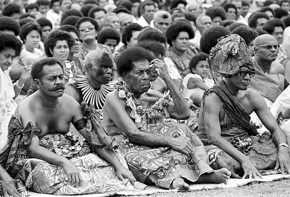 Locals attending traditional native kava ceremony at tribal gathering in Fiji, South Pacific