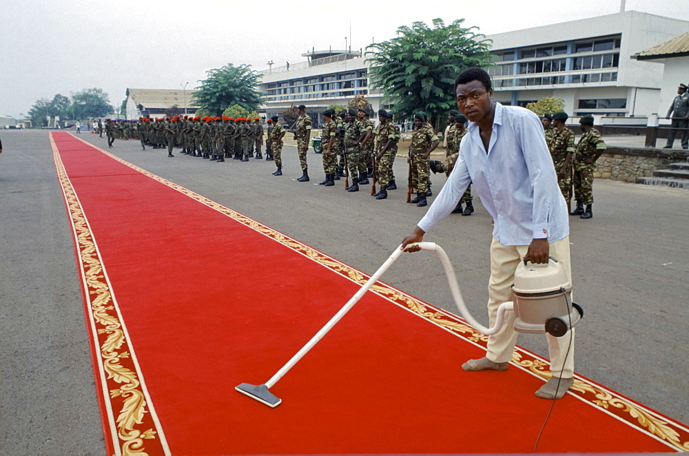 Red carpet being cleaned ready for VIP arrival in Cameroon, West Africa