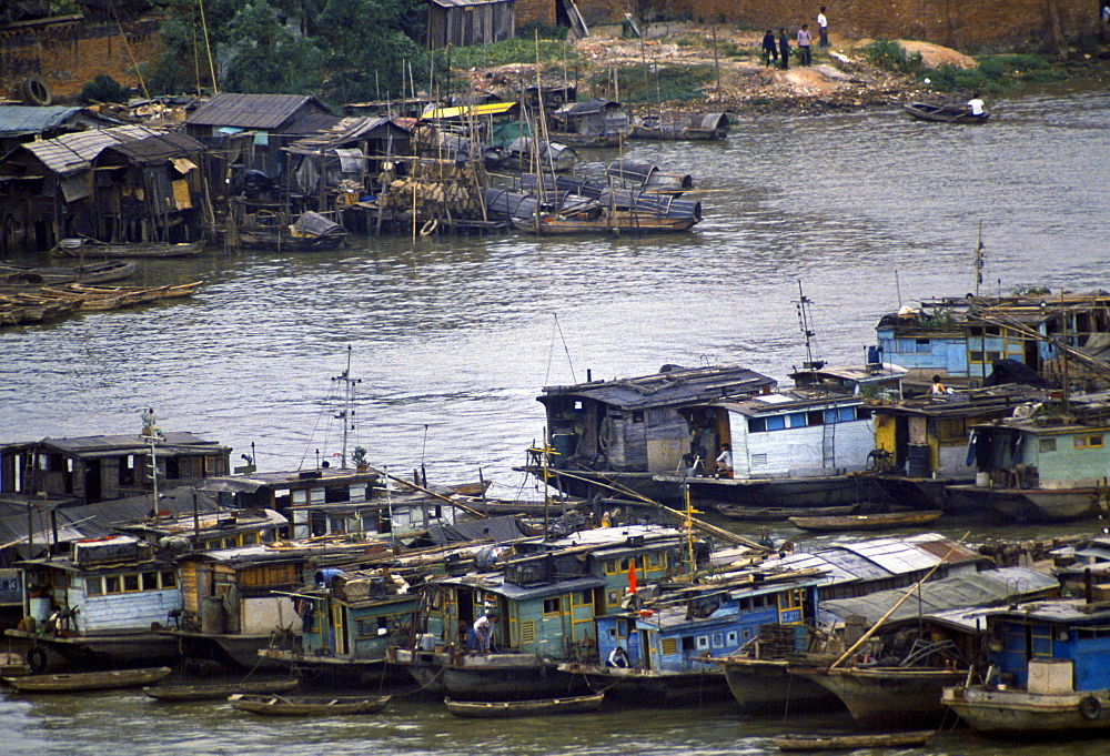 Houseboats and cargo boats on the Pearl River at Canton, China in the 1980s