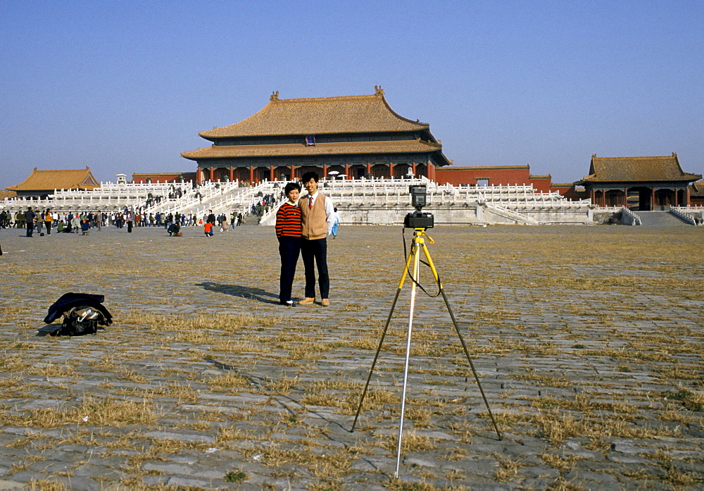 Chinese people taking souvenir photograph at the Forbidden City in Tiananmen Square in Peking, now Beijing, China in the 1980s