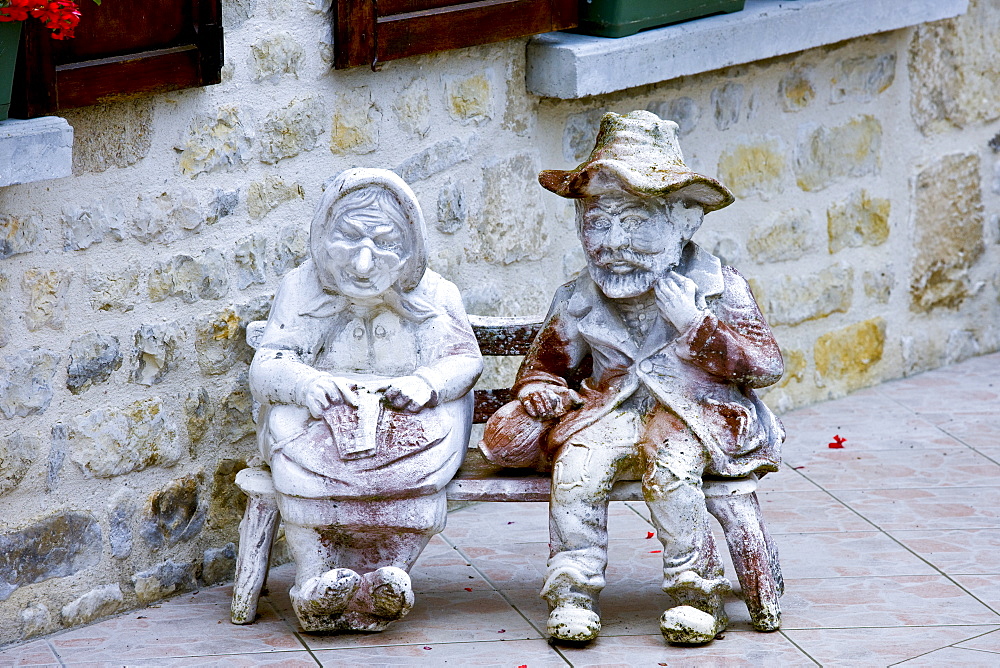 Garden ornament in paved garden in Liesville-sur-Douve, Normandy, France