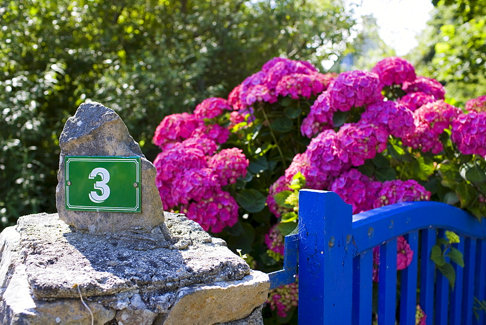 Number 3 outside a French house at St Germain Des Vaux in Normandy, France