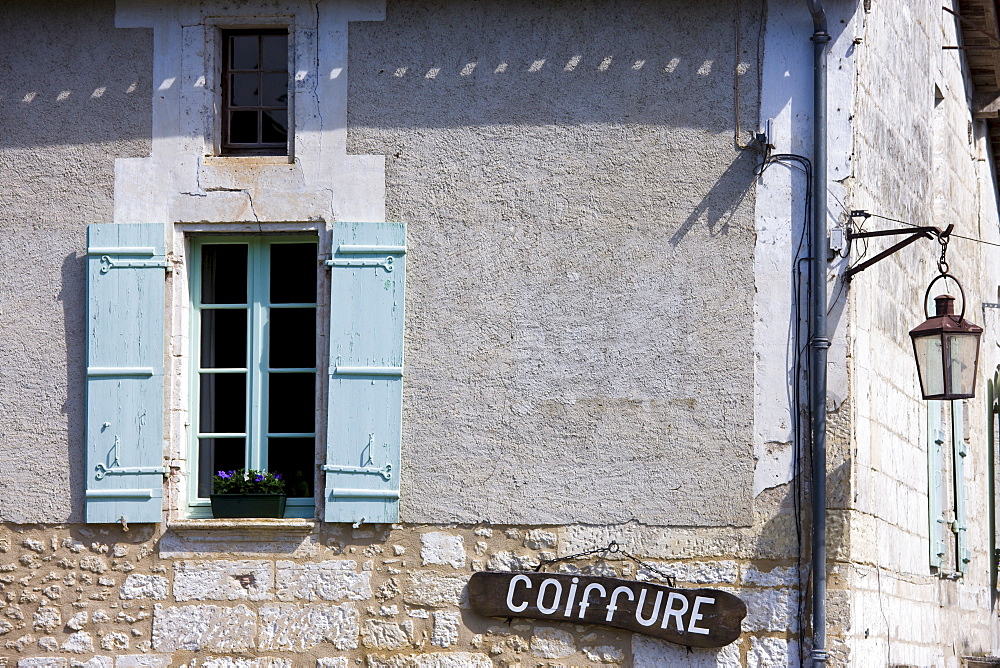 Coiffure in quaint town of Bourdeilles popular tourist destination near Brantome in Northern Dordogne, France