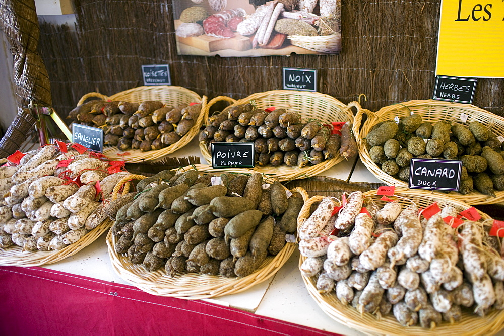 Duck pepper boar herb walnut and hazelnut sausages on sale in Brantome, Dordogne, France